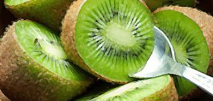 Juicy ripe kiwi fruit in wooden bowl with spoon